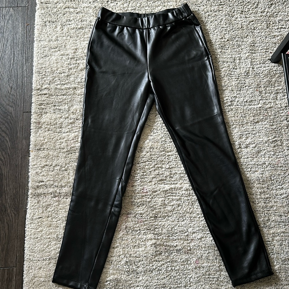 Straight leg black leather pants/leggings.